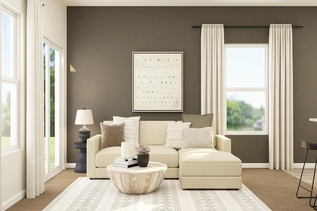 carpeted living room featuring baseboards