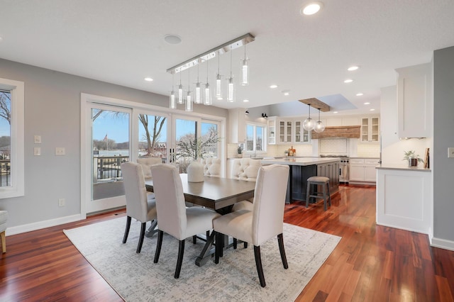 dining area featuring dark wood-type flooring, recessed lighting, and baseboards