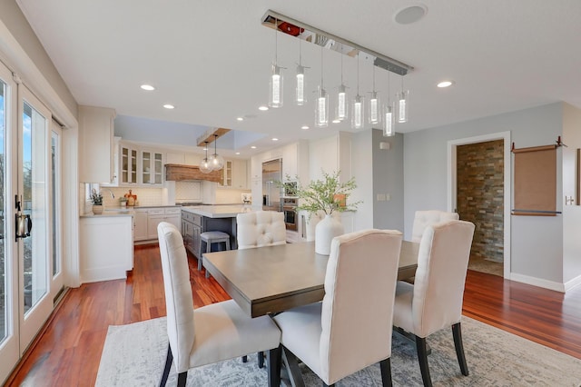 dining room featuring recessed lighting, baseboards, and dark wood-style flooring