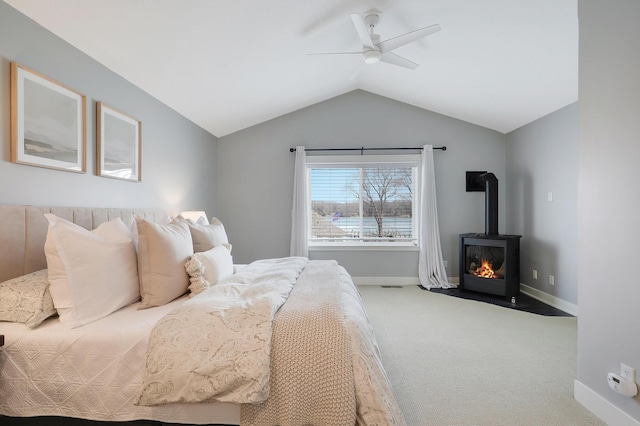 bedroom featuring ceiling fan, baseboards, lofted ceiling, and carpet floors