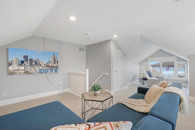 carpeted living area with baseboards, visible vents, lofted ceiling, recessed lighting, and a city view