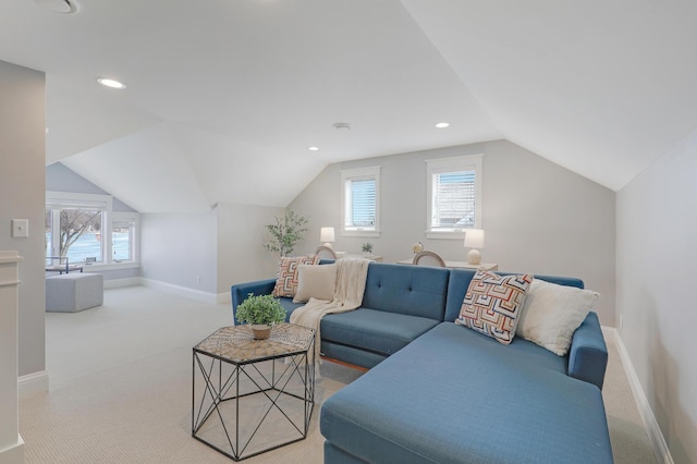 carpeted living area featuring lofted ceiling, recessed lighting, and baseboards