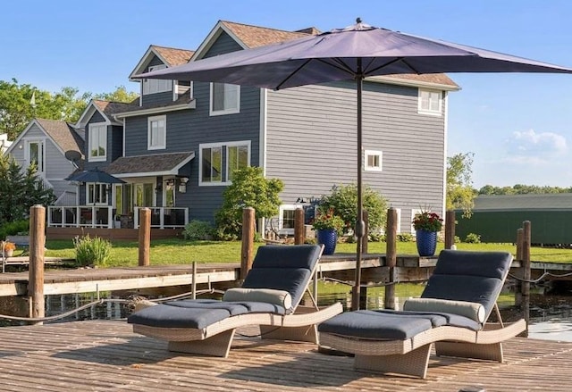 rear view of house featuring a deck