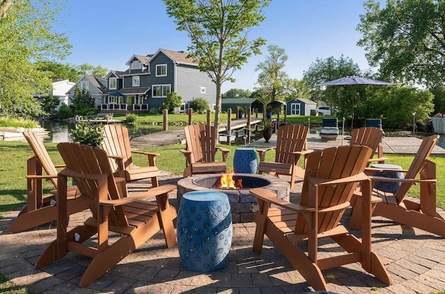 view of patio featuring an outdoor fire pit