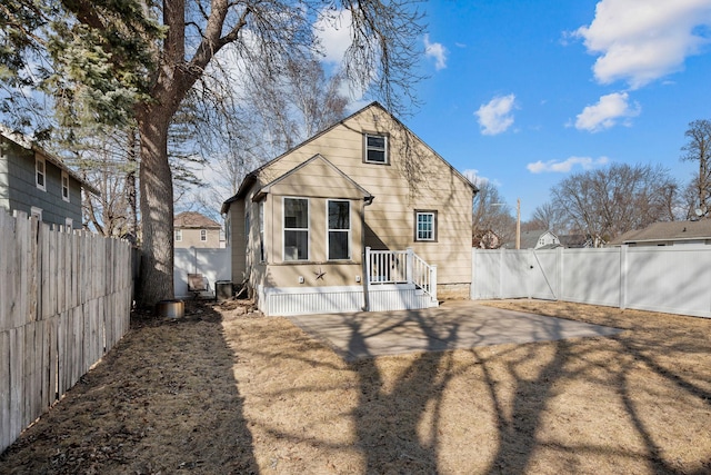 back of house with a patio and a fenced backyard