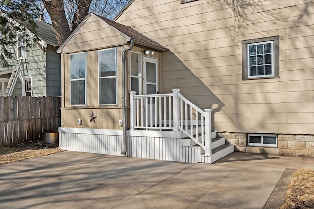 doorway to property with fence