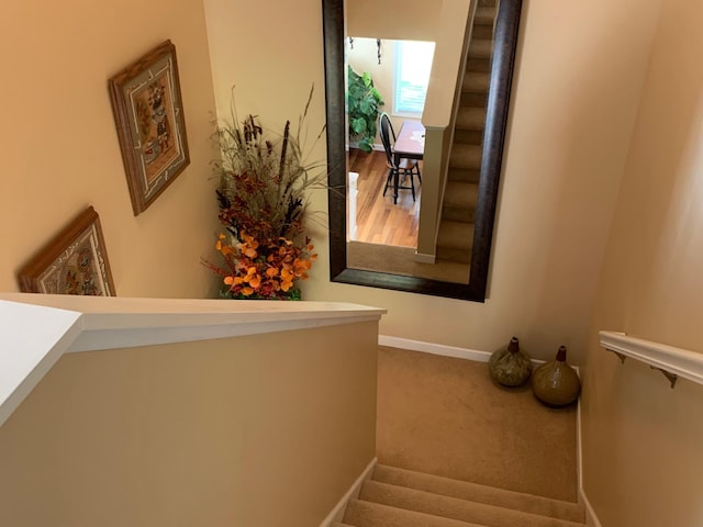 stairs with carpet flooring and baseboards