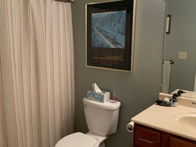 full bath featuring toilet and vanity