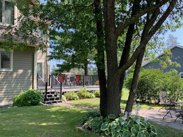 view of yard with a patio area and a deck