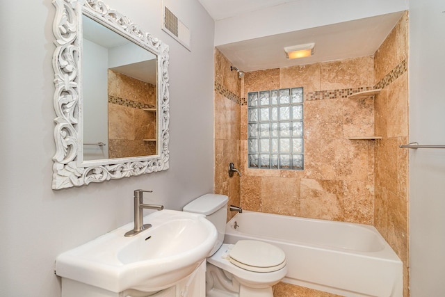 full bathroom featuring toilet, visible vents, shower / bathtub combination, and a sink