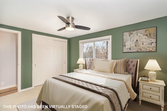 bedroom with a closet, a ceiling fan, baseboards, and carpet floors