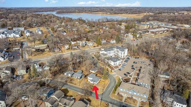 bird's eye view with a water view and a residential view