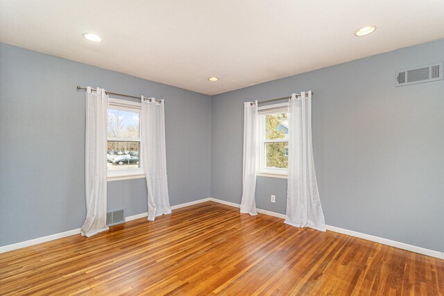 5544 Spruce Rd, Mound, MN 55364 - empty room with healthy amount of natural light, light wood-style floors, and recessed lighting