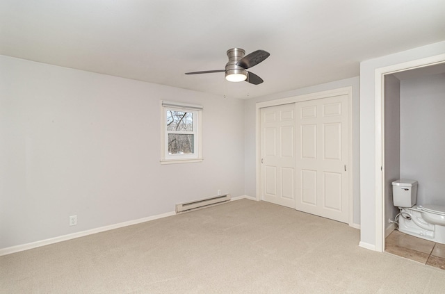 5544 Spruce Rd, Mound, MN 55364 - unfurnished bedroom with baseboard heating, light carpet, a closet, and a ceiling fan
