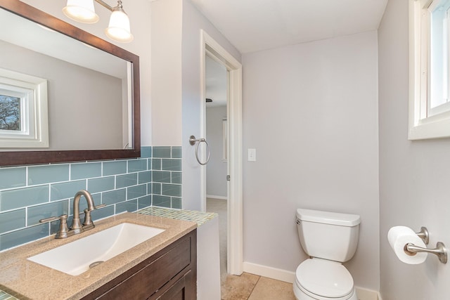 5544 Spruce Rd, Mound, MN 55364 - bathroom featuring vanity, decorative backsplash, and tile patterned flooring