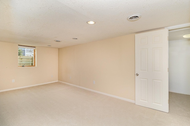 5544 Spruce Rd, Mound, MN 55364 - spare room with a textured ceiling, light carpet, and recessed lighting