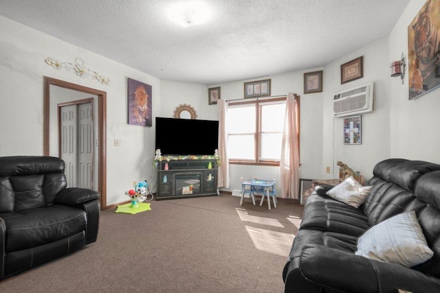 living room with a textured ceiling, carpet flooring, and a wall mounted AC