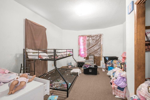 carpeted bedroom with a textured ceiling