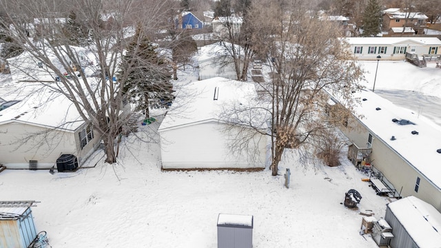 snowy aerial view featuring a residential view