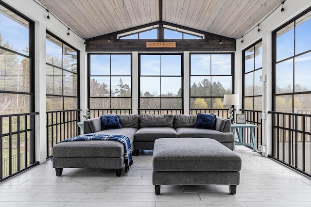 sunroom with lofted ceiling with beams, wood ceiling, and a healthy amount of sunlight