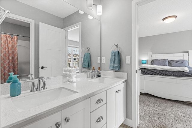 full bath featuring double vanity and a sink