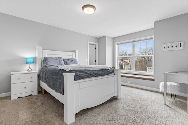 bedroom featuring baseboards and carpet floors