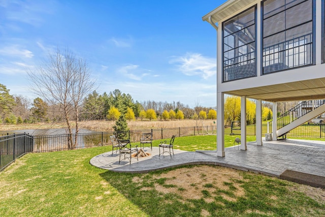 view of yard featuring stairway, a patio area, an outdoor fire pit, and a fenced backyard
