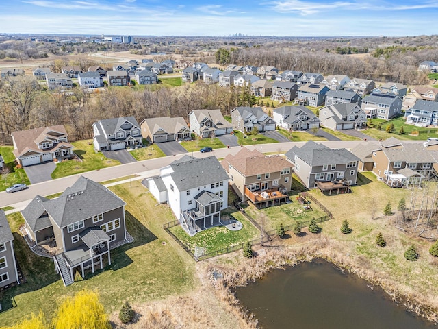 aerial view featuring a residential view and a water view