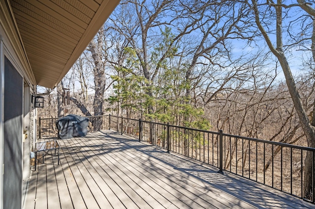 wooden terrace featuring grilling area