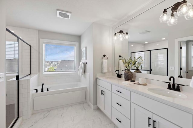 bathroom with a sink, visible vents, marble finish floor, and a stall shower