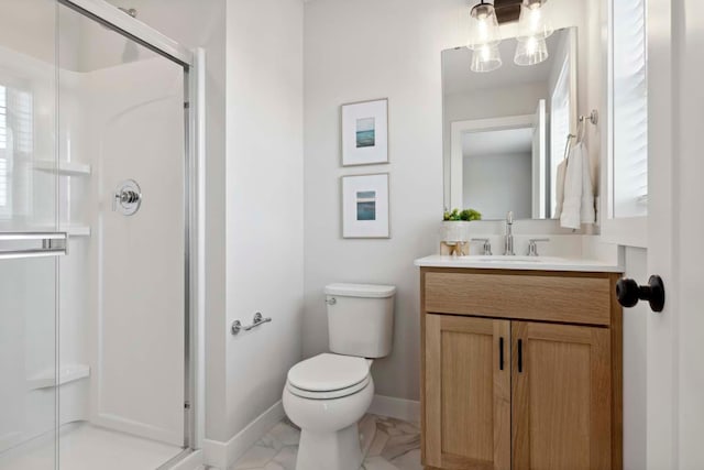 full bathroom with toilet, marble finish floor, a shower stall, baseboards, and vanity