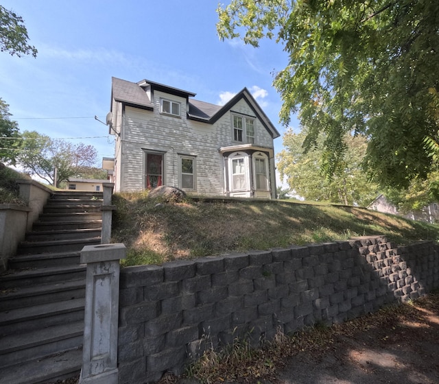 view of front of house featuring stairway