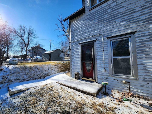 view of snow covered property entrance