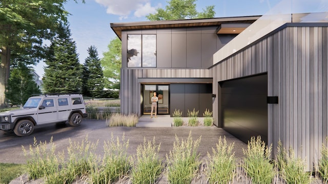 view of front of property with driveway and a garage