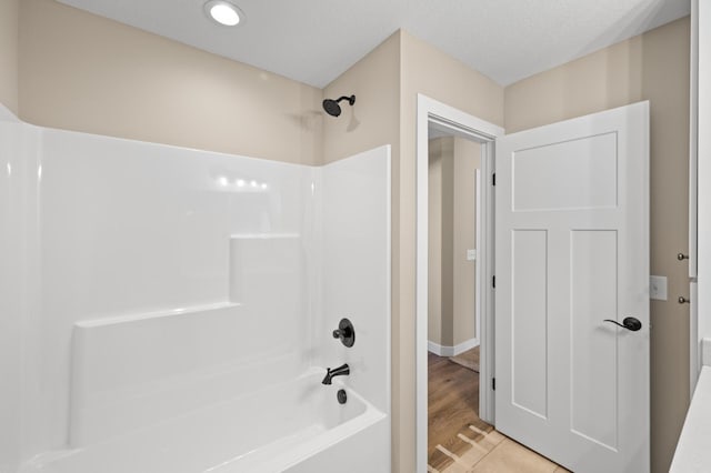 full bath featuring bathtub / shower combination