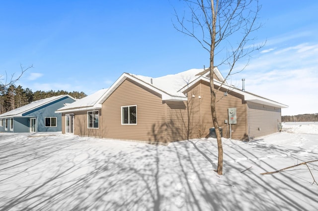 view of snow covered house