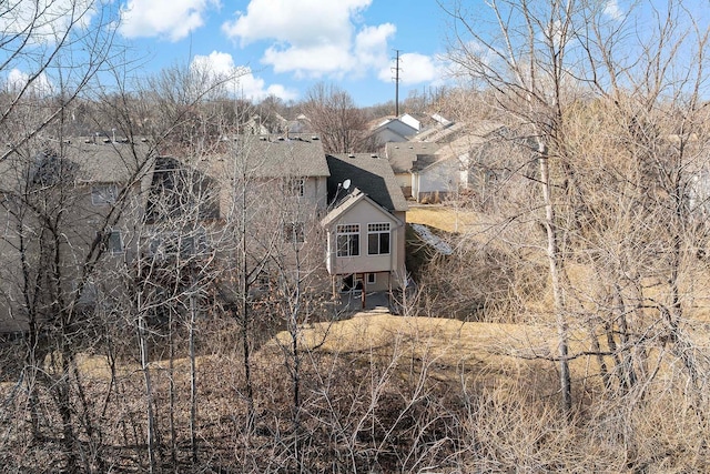 exterior space with a shingled roof