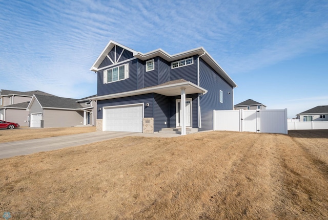 view of front facade with driveway, a front lawn, a garage, and fence