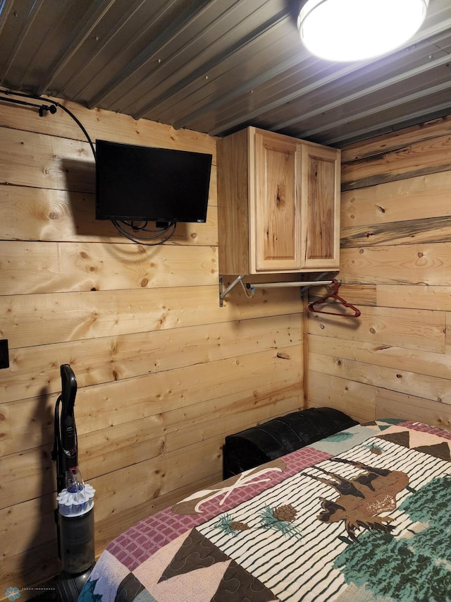 unfurnished bedroom with wooden walls