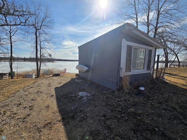 view of outbuilding with an outbuilding and a water view