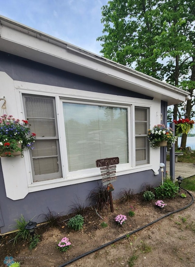 view of side of property featuring stucco siding