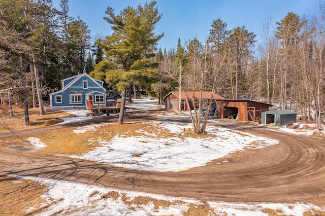 view of front of home with an outbuilding and a detached garage