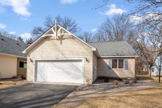 view of front of property with a shingled roof, a garage, crawl space, aphalt driveway, and brick siding