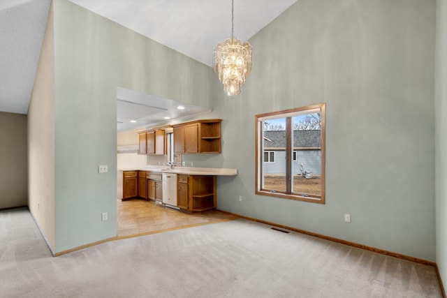 kitchen featuring visible vents, high vaulted ceiling, open shelves, white dishwasher, and light colored carpet