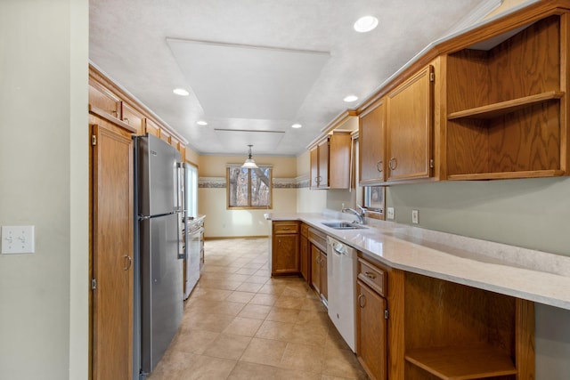 kitchen with open shelves, dishwasher, freestanding refrigerator, light tile patterned flooring, and a sink