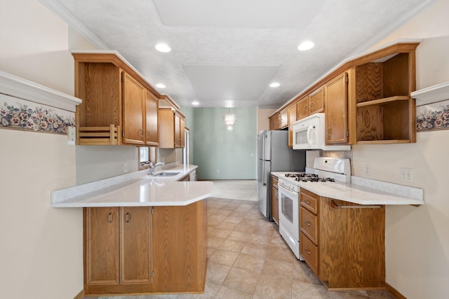 kitchen featuring a sink, open shelves, white appliances, a peninsula, and light countertops