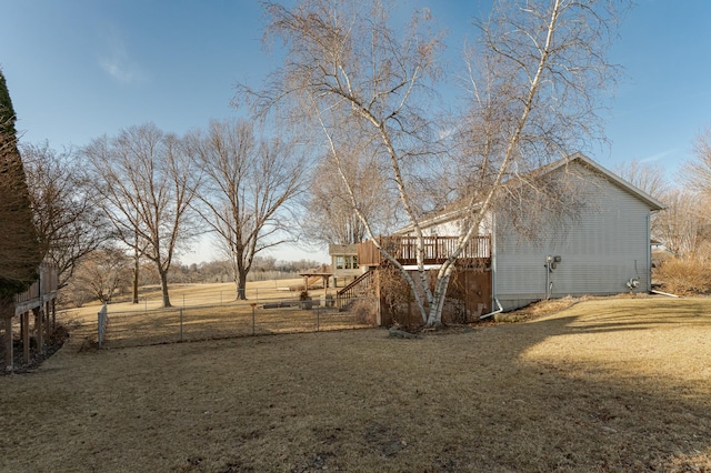 view of yard featuring stairway, fence, and a wooden deck