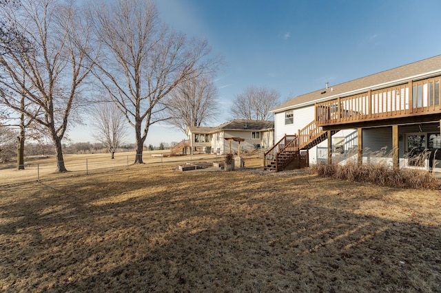 view of yard with stairway and a wooden deck