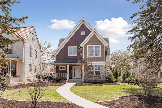 38 Mississippi River Blvd N, Saint Paul, MN 55104 - craftsman-style home with board and batten siding, a porch, and a front yard