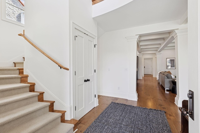 38 Mississippi River Blvd N, Saint Paul, MN 55104 - entrance foyer featuring ornate columns, stairway, wood finished floors, and baseboards